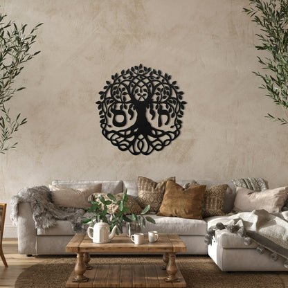 A beautiful metal wall art featuring the Hebrew word "חי" (Chai) meaning "Life," incorporated into a detailed Tree of Life design. The artwork is displayed in a cozy, rustic living room with a beige sofa, earth-toned cushions, and a wooden coffee table adorned with plants and tea set.